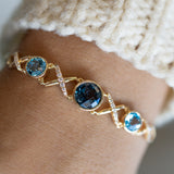 14K Yellow Gold .22CTW Diamond & Blue Topaz "XO" Bracelet