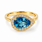 10K Yellow Gold East-West Pearshape Blue Topaz & .34CTW Diamond Halo Ring